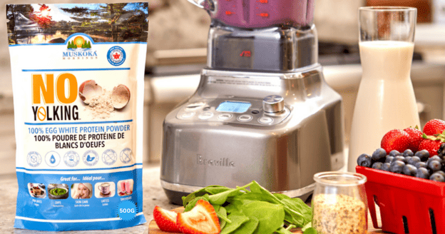 A bag of No Yolking infront of a blender with smoothie ingredients